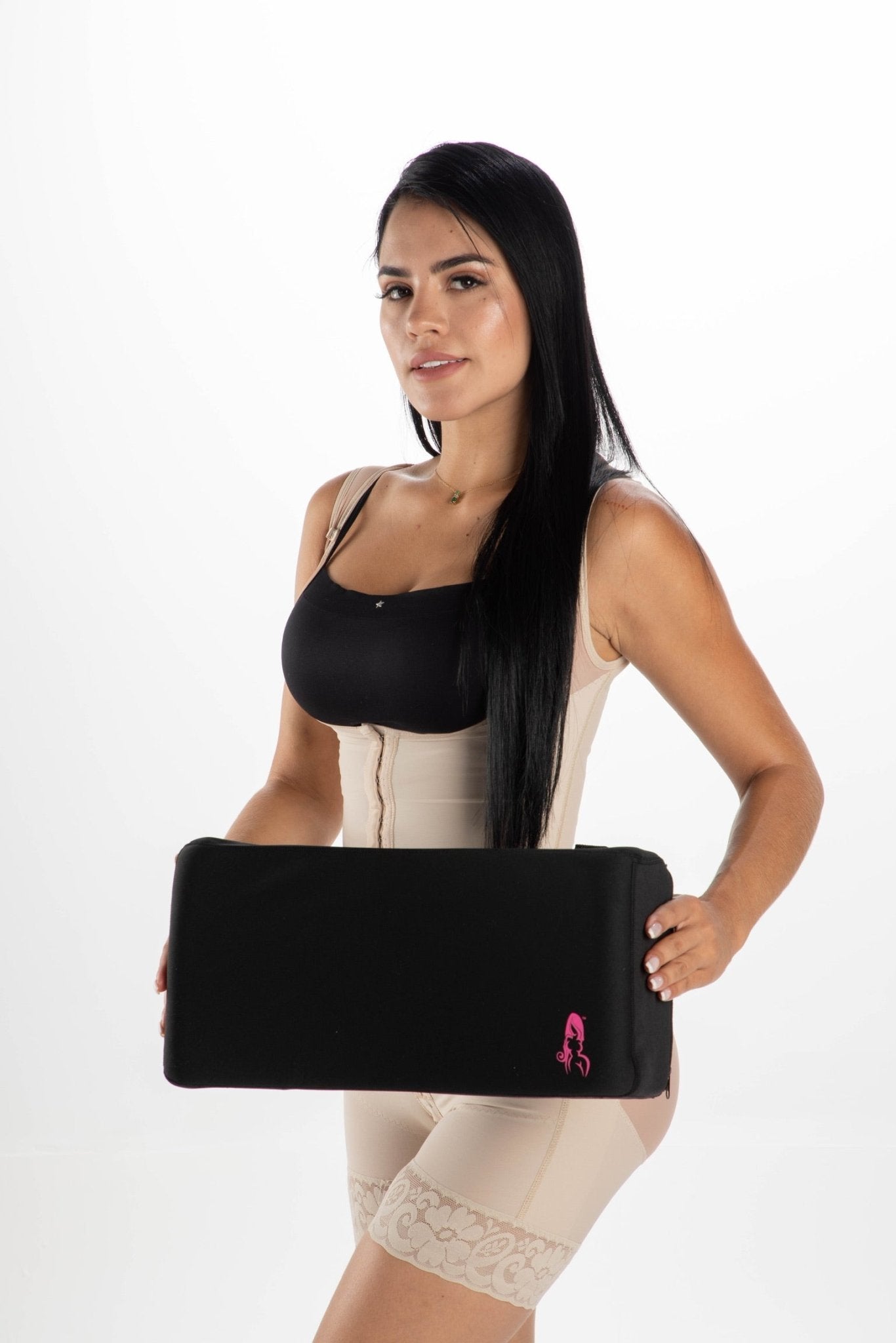 Woman in Post-Surgery Faja Holding BBL Back Support Cushion – Lumbar Pillow for BBL Recovery